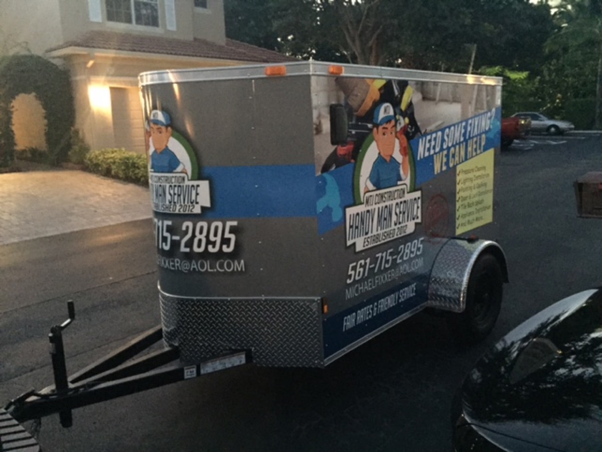 MTJ Construction trailer — services list and contact info